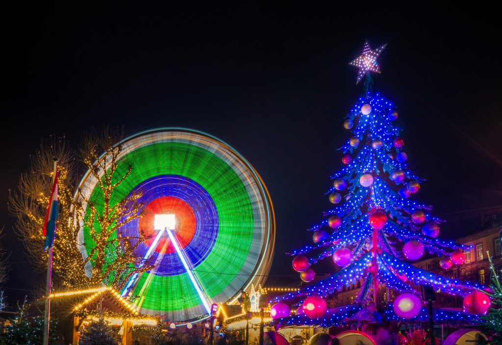 Fun rides at the Christmas market in Luxembourg, a dancing Christmas tree and a Ferris wheel