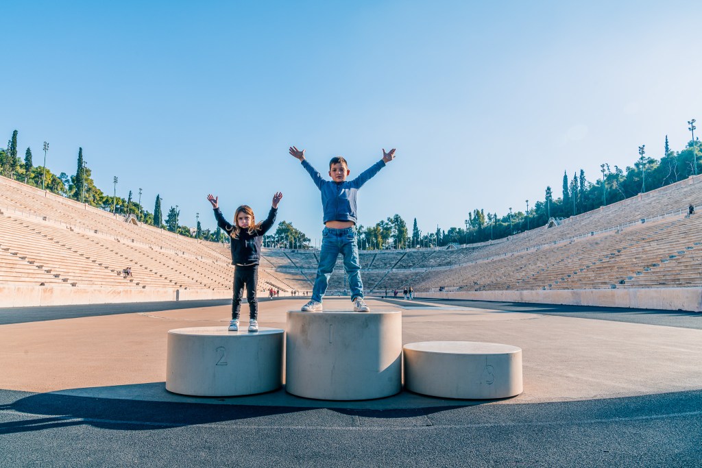 Podium at the Panathenaic Stadium | 2 days in Athens with kids itinerary | Family travel destinations | Tips for traveling with kids | www.worldwildschooling.com