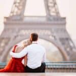 Couple near the Eiffel tower in Paris, France 12 Dreamy European Destinations Made for a Romantic Getaway