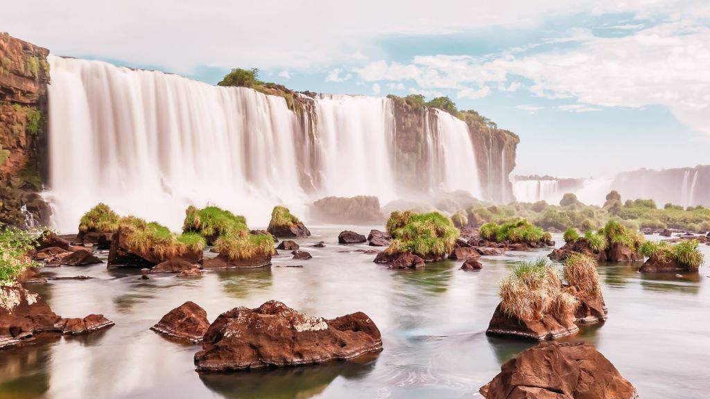Majestic Waterfalls Around the World to Add to Your Bucket List Iguazu Falls, Argentina/Brazil