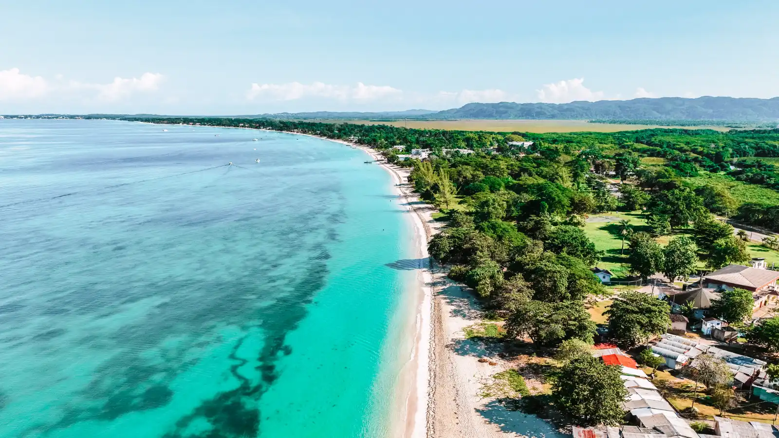 12 Top Summer Destinations in June for a Perfect Summer Getaway 12 Top Summer Destinations in June Negril Jamaica © Romaine W Shutterstock 2399599527 - 12 Top Summer Destinations in June for a Perfect Summer Getaway