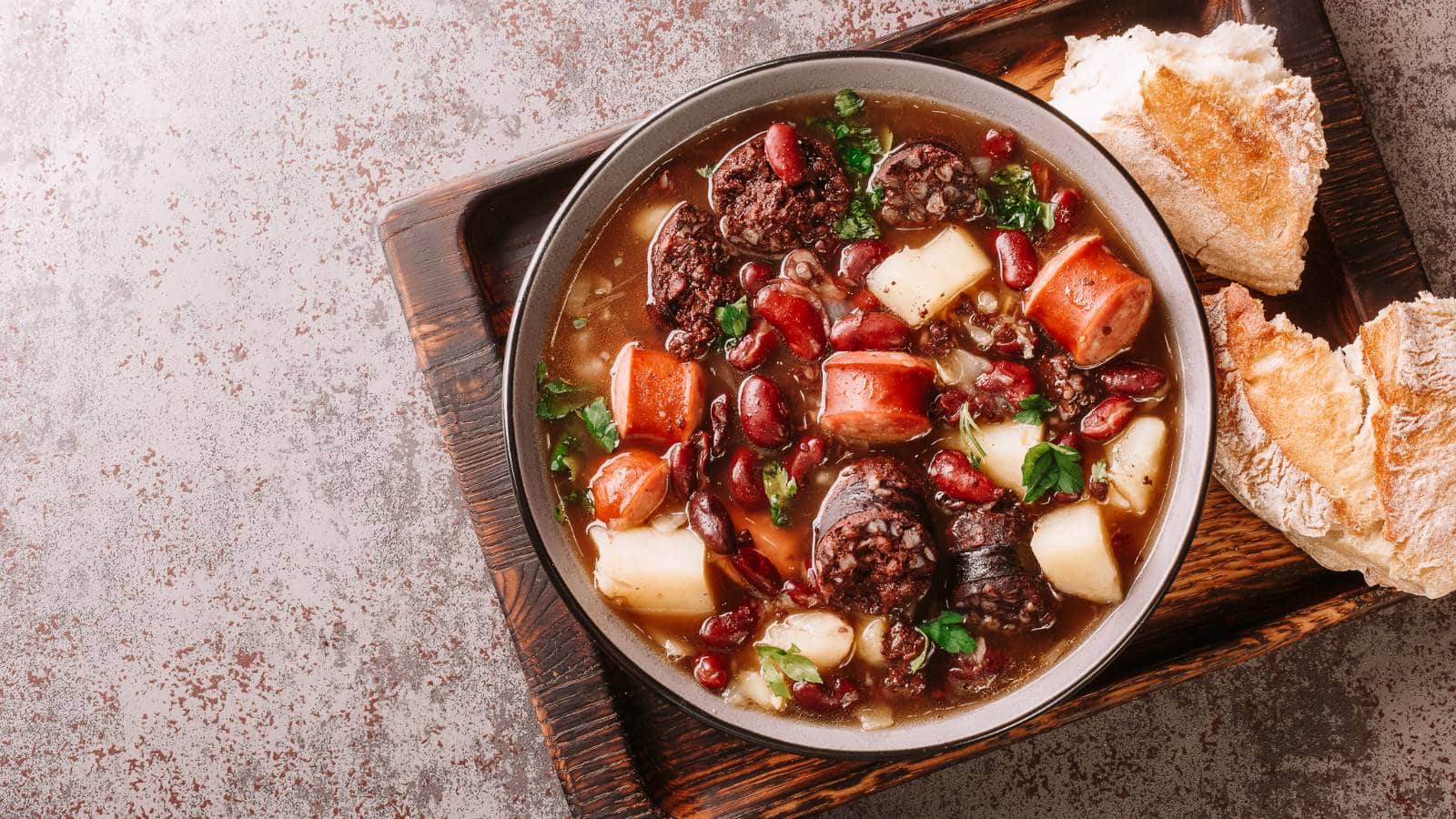 12 Portuguese Dishes So Good, You'll Want To Book a Flight Just To Eat Portuguese Dishes Sopa da Pedra Almeirim © FomaA Adobe Stock 498223699 - 12 Portuguese Dishes So Good, You'll Want To Book a Flight Just To Eat