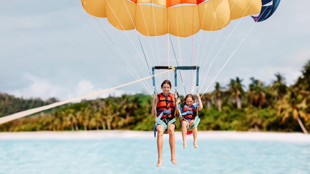 © Famveldman / Adobe Stock Best_Things_To_Do_in_Zanzibar_Try_Your_Hand_at_Watersports_parasailing